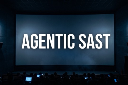 An AI-generated image of a talk title shown on a large, dimly lit conference screen above a silhouetted audience.